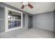 Covered patio with ceiling fan and view to the outdoor screened lanai at 1853 Pasqua Pl, The Villages, FL 32163
