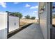 Backyard with storage shed, garden, and walkway next to the house at 1853 Pasqua Pl, The Villages, FL 32163