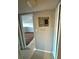 Hallway view featuring electrical panel, tile flooring, and entryway into another room at 1928 Conway Rd # 23, Orlando, FL 32812