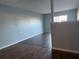 Living room featuring hardwood floors and grey walls in an open-concept design at 1928 Conway Rd # 23, Orlando, FL 32812