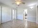 Bedroom with a ceiling fan and view to two adjacent rooms at 193 Bay Rd, Mount Dora, FL 32757