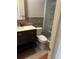 Tastefully updated bathroom with modern vanity and tiled walk-in shower and glass doors at 2181 Gretna Dr, Deltona, FL 32738