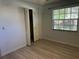 Bright bedroom featuring a closet and window with natural lighting at 2181 Gretna Dr, Deltona, FL 32738