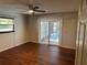 Bedroom with ceiling fan offers sliding glass doors providing access to the private pool at 2181 Gretna Dr, Deltona, FL 32738