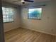 Well-lit bedroom with two windows showcasing the natural outdoor scenery at 2181 Gretna Dr, Deltona, FL 32738
