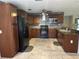Updated kitchen with sleek black appliances, granite countertops, and ample cabinet space at 2181 Gretna Dr, Deltona, FL 32738