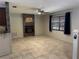 Comfortable living room featuring a stone fireplace and tile flooring at 2181 Gretna Dr, Deltona, FL 32738