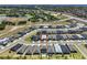 Aerial view showcasing a single-Gathering home nestled in a well-planned community with beautiful landscaping and green spaces at 2183 Ridge Pointe Ln, Clermont, FL 34715