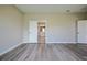 An airy bedroom showing the floor, walls, door to the bathroom and closet at 2183 Ridge Pointe Ln, Clermont, FL 34715