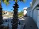 Home exterior featuring brick driveway, bench, and well-maintained landscaping at 2183 Ridge Pointe Ln, Clermont, FL 34715