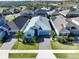 Charming single-Gathering home with well-maintained landscaping, a brick driveway, and a two-car garage at 2183 Ridge Pointe Ln, Clermont, FL 34715