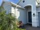 Inviting front entrance with a quaint bench and covered entryway at 2183 Ridge Pointe Ln, Clermont, FL 34715