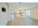 Spacious living area offers ample natural light, hard surface floors, and a seamless transition to other living spaces at 2183 Ridge Pointe Ln, Clermont, FL 34715
