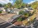 An aerial view of a single-story home surrounded by lush landscaping, showcasing its prime location and neighborhood at 219 N Rossiter St, Mount Dora, FL 32757