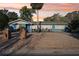 Charming single-story home with a well-kept yard and attractive landscaping at 219 N Rossiter St, Mount Dora, FL 32757
