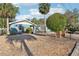 Exterior showcasing well-maintained landscaping and curb appeal at 219 N Rossiter St, Mount Dora, FL 32757