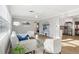 Inviting living room with wood floors, lots of light, stylish furnishings, and neutral decor at 219 N Rossiter St, Mount Dora, FL 32757
