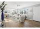 Bright living room with hardwood floors, fan, and large windows at 219 N Rossiter St, Mount Dora, FL 32757