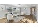 Inviting living room featuring natural light, hardwood floors, and stylish furniture at 219 N Rossiter St, Mount Dora, FL 32757