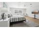 Beautiful main bedroom featuring stylish furniture, a ceiling fan and lots of light at 219 N Rossiter St, Mount Dora, FL 32757