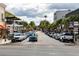 Bustling main street lined with shops, cafes, and palm trees, showcasing a vibrant community atmosphere at 219 N Rossiter St, Mount Dora, FL 32757
