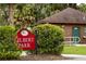 Welcome to Gilbert Park sign amidst lush greenery, near a building with restrooms, offering convenience at 219 N Rossiter St, Mount Dora, FL 32757