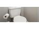 Clean powder room featuring a well-maintained toilet and a gray wall at 219 N Rossiter St, Mount Dora, FL 32757