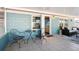 Screened in porch with dining area and seating area at 219 N Rossiter St, Mount Dora, FL 32757