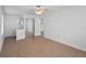 Bright bedroom featuring ensuite with vanity, mirrored closet doors and a ceiling fan at 2210 Stonington Ave # 2210, Orlando, FL 32817