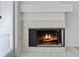 Cozy fireplace with decorative tile surround, perfect for a relaxing ambiance at 2210 Stonington Ave # 2210, Orlando, FL 32817