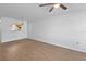 Spacious room featuring wood floors and a view to the kitchen area at 2210 Stonington Ave # 2210, Orlando, FL 32817
