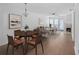 Inviting living room with a dining area and a fireplace, filled with natural light at 2210 Stonington Ave # 2210, Orlando, FL 32817