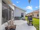 Backyard patio with outdoor seating and a grill, perfect for outdoor entertaining at 22247 Draw Bridge Dr, Leesburg, FL 34748