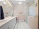 Bathroom featuring a vanity, toilet, and a glass door shower at 22247 Draw Bridge Dr, Leesburg, FL 34748