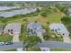Charming single-story home with lush landscaping, well-manicured lawn, and a nearby lake at 22247 Draw Bridge Dr, Leesburg, FL 34748