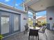Relaxing screened patio featuring a cozy seating area with a table and chairs and exterior access at 22247 Draw Bridge Dr, Leesburg, FL 34748