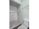 Bathroom with a new tiled shower with designer tile flooring and a built-in niche at 234 S Central Ave, Apopka, FL 32703