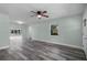 Spacious living room featuring wood-look floors, large windows, and recessed lighting at 234 S Central Ave, Apopka, FL 32703