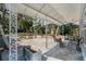 Covered patio with metal awning, outdoor furniture and view of the backyard at 234 S Central Ave, Apopka, FL 32703