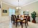 Inviting dining room with elegant decor, lighting, and ample natural light at 24112 Robinwood St, Leesburg, FL 34748