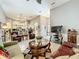 Comfortable living room featuring a view to an open floor plan and neutral colors at 24112 Robinwood St, Leesburg, FL 34748