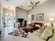 Bright living room featuring tile flooring, vaulted ceilings, and modern decor at 24112 Robinwood St, Leesburg, FL 34748