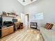 Home office with desk, chair, sofa, shelving, a world map, and lots of natural light at 24112 Robinwood St, Leesburg, FL 34748