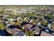 Aerial view of a well-manicured home in a mature neighborhood with established landscaping and a serene atmosphere at 2428 Maverick Way, The Villages, FL 32162