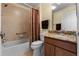 Bathroom featuring a shower and tub combination, a toilet, and a single sink vanity at 2428 Maverick Way, The Villages, FL 32162