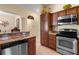 Kitchen with granite countertops, stainless appliances and wood cabinets at 2428 Maverick Way, The Villages, FL 32162