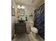Modern bathroom featuring a bowl sink, vanity, and a decorative shower curtain at 2442 Foxhollow Rd, Tavares, FL 32778