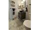 Stylish bathroom with a bowl sink, vanity, and beach-themed decor at 2442 Foxhollow Rd, Tavares, FL 32778