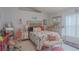 Charming bedroom with a large mirror, pink accents, and plenty of space for relaxation and personal touches at 2442 Foxhollow Rd, Tavares, FL 32778