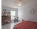 Light and airy bedroom with ceiling fan, beach accents and an elegant modern dresser at 2442 Foxhollow Rd, Tavares, FL 32778
